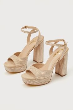 The Lulus Pearlla Beige Suede Pearl Platform Ankle Strap High Heel Sandals are the perfect mix of elegance and fabulousness all-in-one! Dainty faux pearl details embellish these soft faux suede heels that feature a trendy square toe upper (atop a 1"" toe platform), a wide toe strap, and matching straps that sprout from the sides to wrap and secure around the ankle with a gold buckle. A sky-high block heel is sure to make you stand out wherever you go! 4. 5" wrapped block heel. Lightly cushioned Tan Platform Heels, Beige Block Heel Sandals For Party, Summer Pearl Embellished Block Heel Heels, Glamorous Summer Wedding Guest Sandals, Glamorous Pearl-embellished Sandals For Spring, Glamorous Champagne Sandals For Summer, Summer Embellished Champagne Heels, Summer Prom Sandals In Champagne Color, Glamorous Beige Ankle Strap Sandals