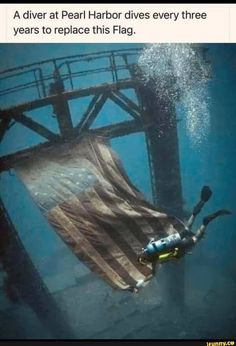 a person diving in the water with a flag draped over their body to protect them