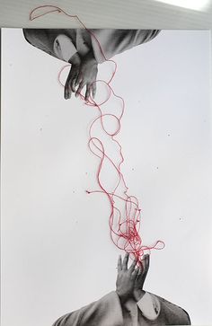 two hands reaching for something red string