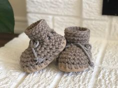 Functional as slippers or booties, these Cabin slippers will keep little toes toasty warm this winter! Hand-crafted using 100% wool, with sheepskin lining, they'll make sure your little one is comfortable all winter long. With suede soles, they're also durable enough to withstand your toddler's typical wear-and-tear.   Sizing  Newborn 0-3+ months with soles measuring approximately 4" B3- 3-12 months with soles measuring approximately 5" B5- 1-2 years with soles measuring approximately 5.5" B7- 2 Winter Booties With Soft Sole And Closed Toe, Winter Beige Closed Toe Booties, Beige Closed Toe Winter Booties, Winter Booties With Soft Sole And Round Toe, Winter Round Toe Booties With Soft Sole, Brown Winter Boots With Soft Sole, Cozy Winter Slippers With Soft Sole, Comfortable Winter Booties With Soft Sole, Cozy Soft Booties With Round Toe