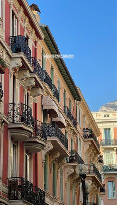 an apartment building with balconies and wrought iron balcony railings in paris, france