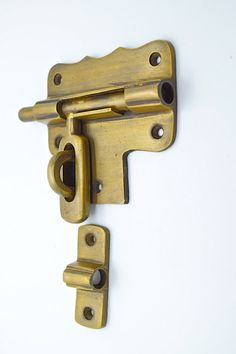 an old brass door handle with two latches