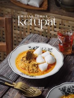 the cover of masak lemak ketupa is shown on two plates