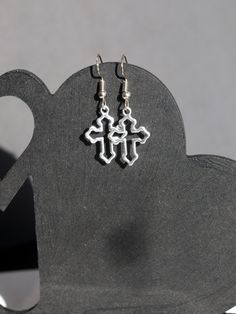 ♥ 10% off when you buy two pairs of earrings. Use code 10OFFTWO at checkout. ♥ Lovely, simple and delicate Silver Cross Earrings, Holy Cross Antique Silver Earrings. Hollow Cross is 1.5 cm (15 mm) wide by 1.8 cm (1.8 mm) length.  The Ear Hooks are silver plated. Crosses are silver toned. Ear Studs and Clip On's in silver tone only.  Please see photo for details.  Thank you for looking! Silver Cross Earrings, Antique Silver Earrings, Holy Cross, Christian Cross, Small Crosses, Cross Earrings, Cross Jewelry, Silver Cross, Pierced Ears