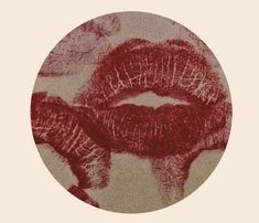 an image of red lips in a circle