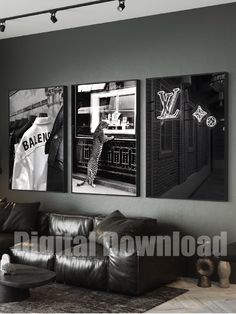 three black and white pictures hang on the wall above a couch in a living room