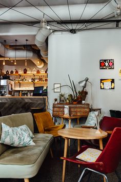 a living room filled with furniture and decor