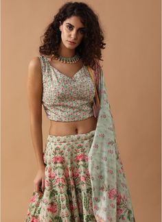 This artistic floral print moss green crepe sleeveless crop top with sweetheart neck is teamed with a printed bias cut skirt and a dupatta. Peplum Lehenga, Shimmer Lehenga, Royal Blue Lehenga, Sequins Lehenga, Maroon Lehenga, Printed Lehenga, Ladies Suits, Blue Lehenga, Bias Cut Skirt