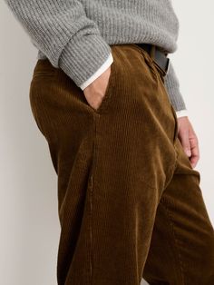 The cool-weather version of our best-selling pleated chino. You'll love how the rugged corduroy feels easy + casual. Single pleat for a little extra movement throughout the leg. Finishing details: real Corozo buttons and our signature "X" belt loop in the back For anyone 5’9" and under, we suggest ordering the regular inseam. For anyone taller than 5'9", we suggest ordering the long inseam. Fits true to size. Size 32 measures 34.5" around the waist and 44.5" around the hip. Leg opening measures