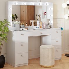 a white vanity with lights on it and a stool