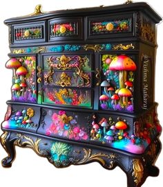 an ornate dresser with many colorful decorations on it's sides and drawers, all painted in different colors