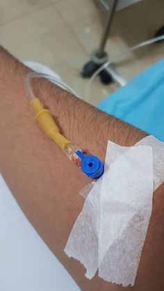 a person with an iv attached to their arm