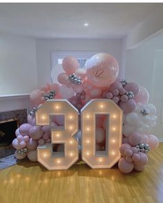 balloons and lights are arranged in the shape of the number 50