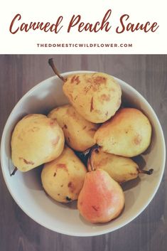 a white bowl filled with pears on top of a wooden table next to text that reads