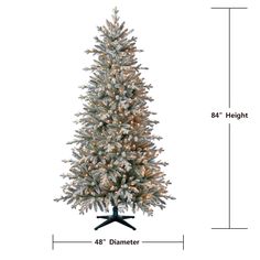 a white christmas tree with snow on it and measurements for the height, from top to bottom