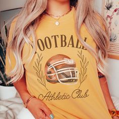 Football Athletic Club Comfort Color Tee - Limeberry Designs Game Day Baseball T-shirt With Logo Print, Game Day T-shirt With Logo For Baseball Season, Sports Fan T-shirt For Baseball Season, Collegiate Tops With Team Logo For Game Day, Sports Fan T-shirt In Team Colors, Sports Fan Tops With Team Logo For Baseball Season, Team Colors Tops For Game Day, Team-colored Tops For Baseball Season Fan Merchandise, Game Day Sports Fan T-shirt With Crew Neck