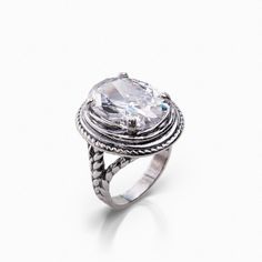 Large Bling Cubic Zirconia Sterling Silver Ring. .925 sterling silver beauty featuring a dramatic 5A-grade, multi-faceted cubic zirconia center stone. The weighty gem is anchored by equally substantial twists of silver rope detail. Slip this on and prepare to hear bravissima upon your arrival. Bohemian jewelry for women, new from Joolala jewelry Engagement Ring Inspiration, Ring Styles, Engagement Ring Styles, Perfect Engagement Ring, Ring Unique, Mens Wedding Rings, Ring Collections, 925 Silver Rings, Bohemian Jewelry