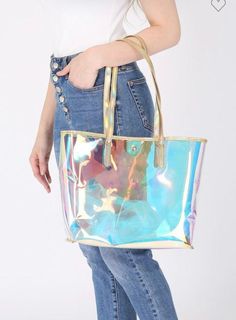 Gold and holographic clear bag. Perfect to haul all the things to your events. 11” x 15” x 5.25” Trendy Metallic Rectangular Bag, Iridescent Rectangular Travel Bag, Trendy Iridescent Bags, Trendy Metallic Bags For Daily Use, Iridescent Trendy Bag For Everyday Use, Trendy Iridescent Bag For Everyday Use, Trendy Iridescent Bags For Everyday Use, Iridescent Rectangular Shopping Bag, Holographic Purse