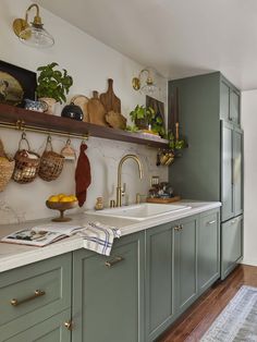 the kitchen is clean and ready for us to use it's counter tops are painted green