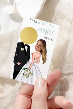 a person holding up a card with an image of a bride and groom