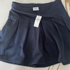 Brand New (Never Worn) Navy Blue Gap School Uniform Skirt. Size M (8). Solid Skirted Skort For School, Lined Skort For School, Lined Skirt Skort For School, Casual Stretch Skirt For School, School Uniform Style Skirt, Casual Stretch Skort For School, Casual Skirted Skort For School, Stretch Lined Skort For School, Solid Color Skirted School Uniform Bottoms