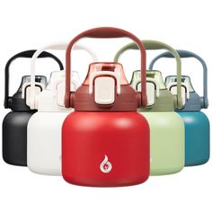 several different colored kettles with handles on them