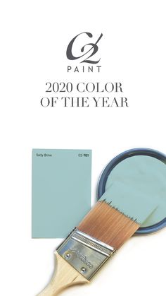 a paint brush with the color of the year on it