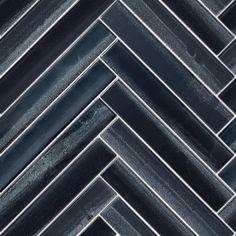 black marble herringbone tile with dark gray grouting in the center and bottom