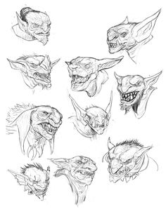 some drawings of demon heads with different expressions and facial features, including the head's eyes