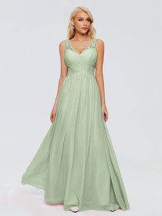 a woman wearing a long green bridesmaid dress