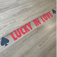 a lucky in love banner on the floor