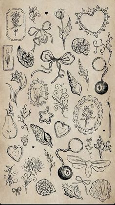 an old book with many different designs on the pages, including hearts and flowers in black ink