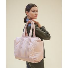 The Baby Tote is an ultra-light convertible for your parenting needs. Encased in cloud-like waterproof nylon, it features ample pockets for staying organized. Wear it as a tote, crossbody, or clip it onto your stroller. Vegan friendly and made for everyone. | Diaper Bags | Women's Baby Tote, Blush (Pink) Caraa  |  Maisonette collects the best children’s products from around the world (unlike Zulily, Etsy, The Tot, Farfetch Kids, Childrensalon, Crate and Kids, Kohls, Wayfair, Buy Buy Baby, Nordst Pink Baby Bags, Pink Diaper Bag, Baby Tote Bag, Stroller Hooks, Sports Bags, Diaper Bags, Buy Buy, Buy Buy Baby, Girls Bags