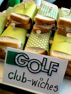 several sandwiches are stacked on top of each other with green and white polka dot wrappers