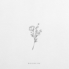 a single flower is shown on the side of a white paper with black lettering that reads,