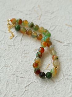 Elevate your summer style with our Multi-Colored Gemstone Beaded Necklace! Handcrafted with intricate beads, this necklace features multi-colored agates strung together to create an array of vibrant colors that complement any outfit, bringing out the color of summer and giving a cool feel. This versatile and stunning necklace will add a touch of luxury to any look. Metal: 18K Recycled Gold Plated On Brass Gemstone: Multicolor Onyx 12mm Length: 390-430mm Weight: 62g Edison Pearls, Necklace Love, Gemstone Beaded Necklace, Onyx Bead, Tiger Eye Stone, Stunning Necklace, Recycled Gold, Stone Necklace, Gemstone Colors