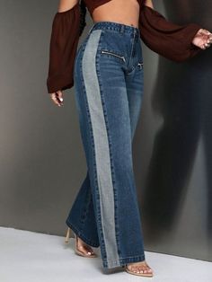 a woman in high rise jeans with an off the shoulder top and side slits