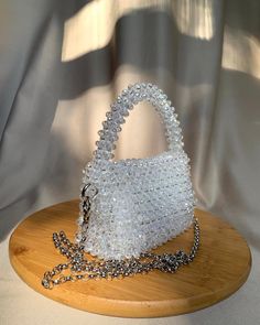 Our sparkling crystal bag is Handmade with the highest quality of crystal beads and clear thread. Shining handmade bag is solidly woven. Size: Width: 15 cm Height: 12 cm Depth: 6 cm Height with hand: 20 cm weight: 0.7 gr This medium size is perfect to hold your keys, cards, money and some cosmetic products.  Our bags are made with love and we will be thankful if you chose our hand. Silver Beaded Crystal Bags, Silver Crystal Beaded Bags, Crystal Beaded Bag, Beads Bag, Beaded Clutch Bag, Handmade Leather Bracelets, Crystal Bags, Beaded Bag, Beaded Clutch