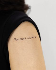 a woman with a tattoo on her arm that says miss you don't miss me