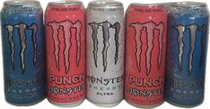 four cans of monster energy drink are lined up