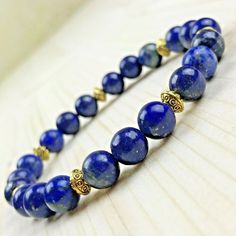 Genuine gemstone bracelet Lapis Lazuli 8mm Golden Tibetan Pearls Delivered in its organza pouch Elegant Crystal Gemstone Bracelet For Meditation, Elegant Crystal Bracelet With Gemstone Beads For Meditation, Elegant Adjustable Lapis Lazuli Beaded Bracelet, Adjustable Elegant Lapis Lazuli Bracelets, Elegant Crystal Bracelet For Meditation, Elegant Hand-strung Crystal Bracelet For Meditation, Elegant Beaded Bracelets With Lapis Lazuli, Elegant Lapis Lazuli Beaded Bracelets, Adjustable Lapis Lazuli Bracelet With Round Beads