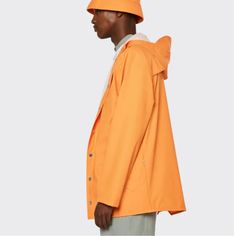 New With Tags! Rains Hooded Button Down (Snap) Rain Jacket. Armpit Vent Holes. Button Snaps At End Of Arms Too. Size Xl. Unisex. Msrp $110. Color: Orange. Approx Measurements (Laying Flat, Not Stretched): Armpit To Armpit: 25” Armpit To End Of Sleeve: 21” Front Length (Fully Zipped/Top Of Zipper To Bottom Hem): 32” Back Length (Below Hood To Bottom Hem): 33” Very Sharp Raincoat And Excellent Quality! Classic Windbreaker For Spring, Solid Color Outerwear With Button Closure For Streetwear, Spring Single Breasted Outdoor Outerwear, Casual Single Breasted Outdoor Outerwear, Casual Single Breasted Outerwear For Outdoor, Casual Single-breasted Outdoor Outerwear, Long Sleeve Windbreaker With Button Closure For Fall, Casual Collared Outerwear With Snap Buttons, Urban Button-up Outerwear With Snap Buttons