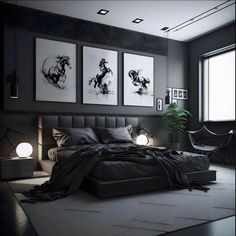 a black and white bedroom with pictures on the wall