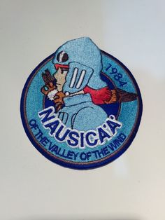 a blue patch with an image of a baseball player holding a bat and wearing a helmet