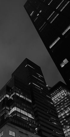 black and white photograph of skyscrapers at night