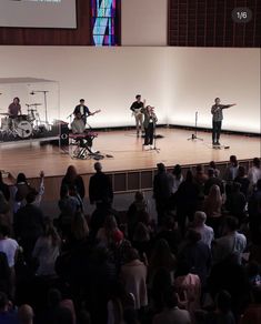 a group of people standing on top of a stage