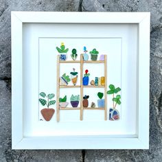 a white frame with some plants on it