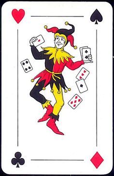 a playing card with an image of a clown holding cards in one hand and two hearts on the other