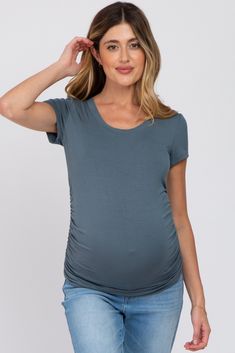 A solid short sleeve fitted top with a round neckline and side ruching. The Deep Teal Basic Short Sleeve Maternity Fitted Top is perfectly bump-friendly! Spring Short Sleeve Tops, Bump Friendly, Spring Short Sleeve Bump-friendly Tops, Bump-friendly Short Sleeve Tops For Spring, Spring Bump Friendly Short Sleeve Tops, Casual Solid Tops With Ruched Sides, Short Sleeve Ruched Stretch T-shirt, Ruched Stretch Short Sleeve T-shirt, Fitted Ruched Short Sleeve T-shirt, Fitted Ruched T-shirt With Short Sleeves