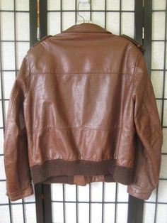 Fine quality vintage leather jacket by Sears, The Leather Shop. Caramel/mahogany brown. Photos get the color accurately. Nice detail seaming and back. Label size 42R - please note measurements below Chest/Bust (armpit to armpit) is 44 inches - interior measure. Bottom edge (ribbing) is 42 inches with easy stretch to 46 inches. Sleeve is 25-1/2 inches. Shoulder seam to seam is 17-1/2 inches. Length is 24-1/2 inches. Zipper closure. Cloth lining in the pockets. Some pilling on the knit ribbing at Vintage Brown Retro Leather Jacket For Winter, Retro Brown Leather Jacket, Vintage Brown Long Sleeve Biker Jacket, Retro Brown Leather Jacket For Winter, Retro Brown Leather Outerwear, Retro Distressed Brown Leather Jacket For Winter, Retro Vintage Brown Biker Jacket For Fall, Retro Brown Leather Jacket For Fall, Retro Distressed Brown Leather Jacket For Fall